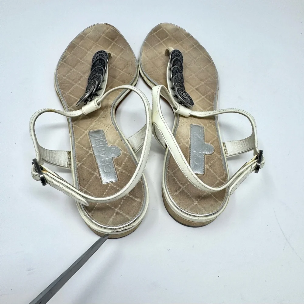 CHANEL White Leather Thong Sandals with Stacked Silver Coin Medallions